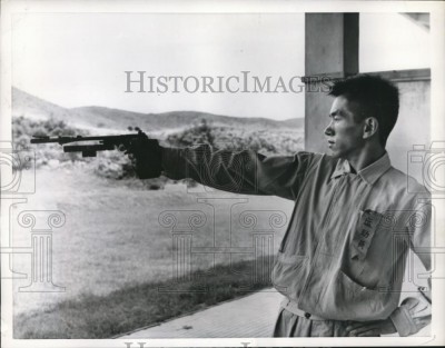A young Chang Hung shooting Rapid Fire Pistol in 1956.